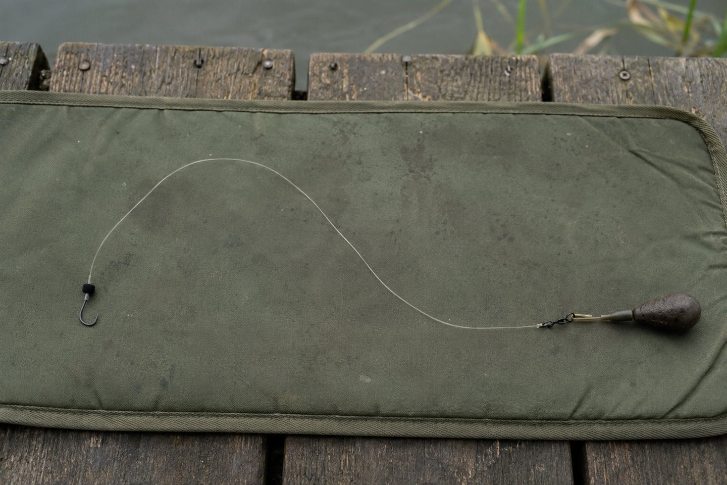 A fixed zig rig with black foam hookbait, clear hooklink, swivel and lead
